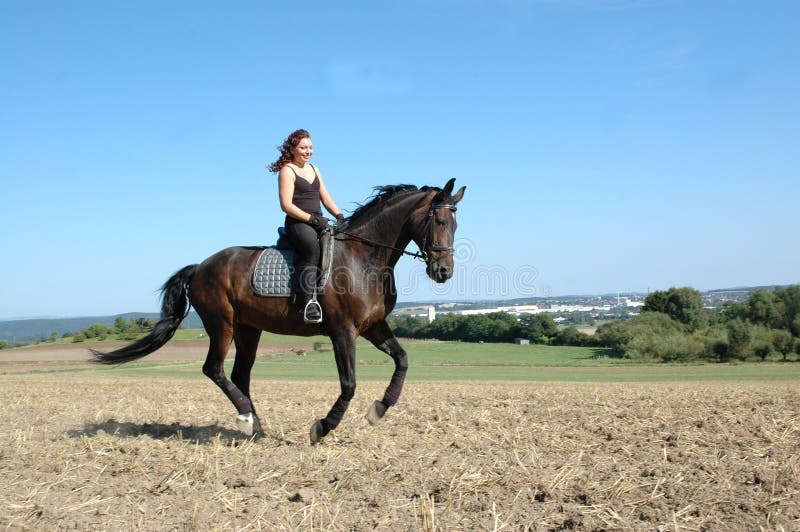 Gallop. Horse and equestrienne.