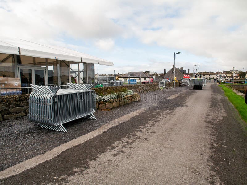 10/04/2019 Galway / Ireland: Stack of metal fences, another stack transported by forklift Temporary pavilion in the background. stock photo