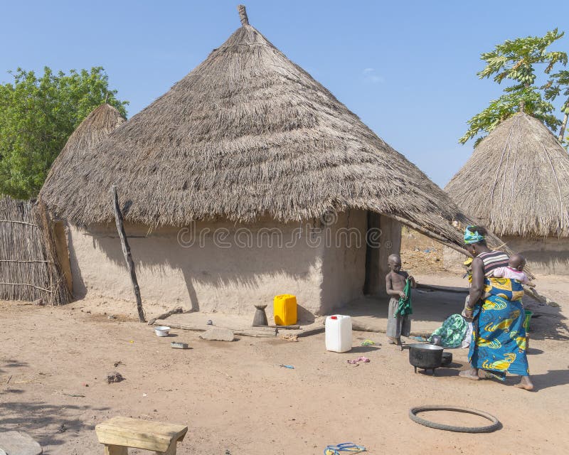 African women with kids and cottages in the village, Gambia. West Africa. Typical architectures stock images, royalty-free photos and pictures