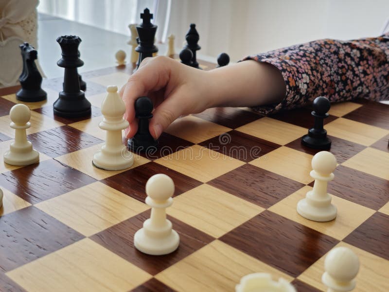 A Game on a Chess Board with Black and White Pieces Stock Photo Image