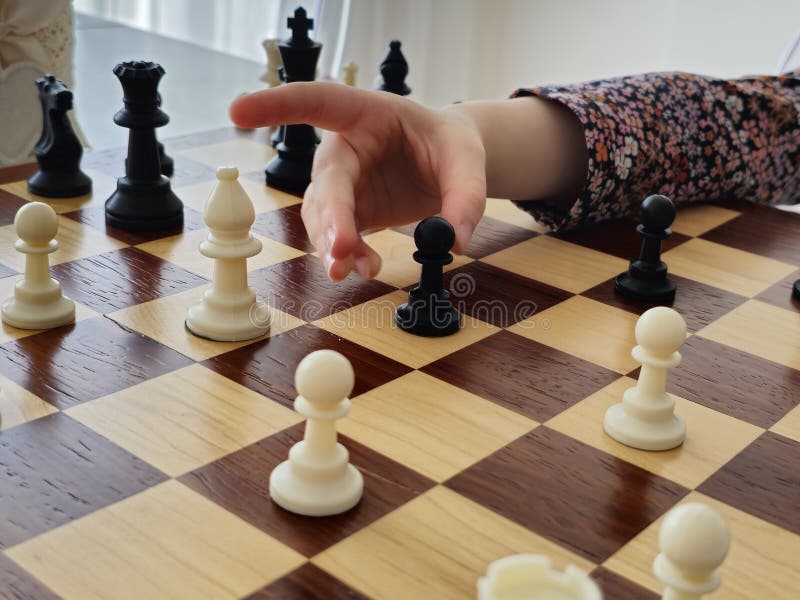A Game on a Chess Board with Black and White Pieces Stock Photo Image