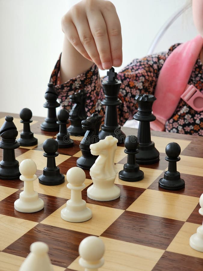 A Game on a Chess Board with Black and White Pieces Stock Photo Image