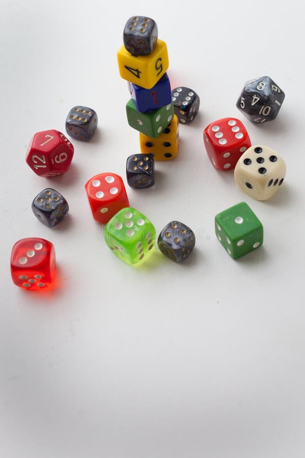 Random Game Rolling Dice Lined Up on a Yellow Background Stock Image