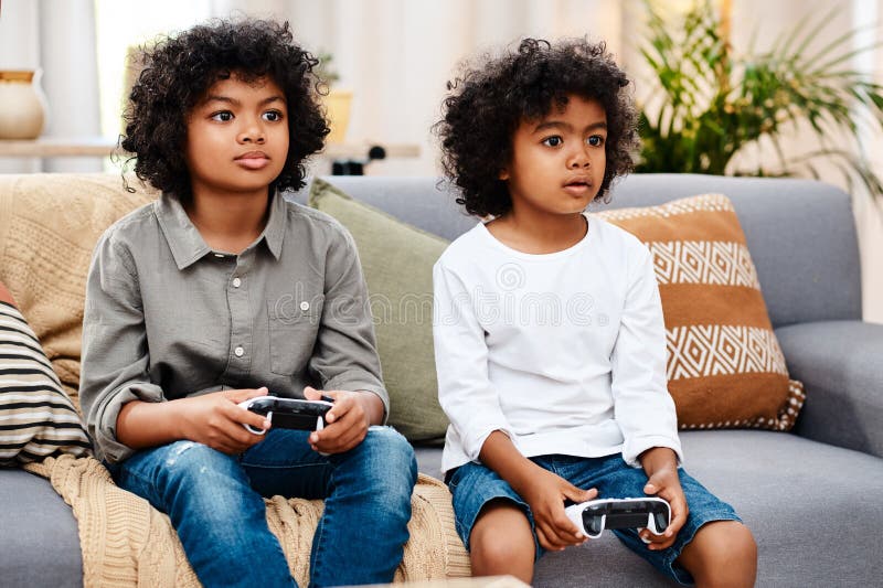 Kids playing video games Stock Photos, Royalty Free Kids playing