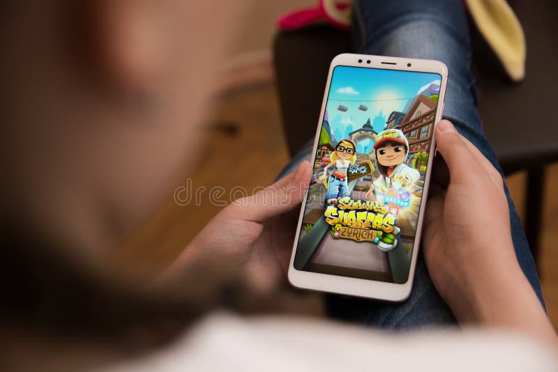 LVIV, UKRAINE - November 08, 2022 : Playing mobile game Subway Surfers on  modern smartphone. Stock Photo