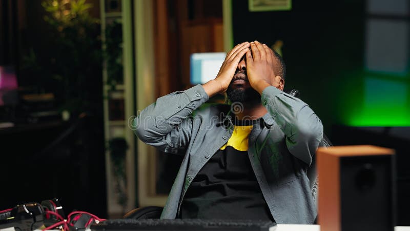 Gamer feeling sad after being defeated in internet videogame stock image