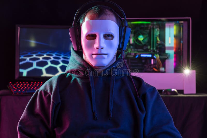 Portrait of the Young  Pro Gamer Playing in Online Video Game. Neon and magenta Colored Room. e-Sport Cyber Games Internet Championship. Motion sweep in image. Portrait of the Young  Pro Gamer Playing in Online Video Game. Neon and magenta Colored Room. e-Sport Cyber Games Internet Championship. Motion sweep in image