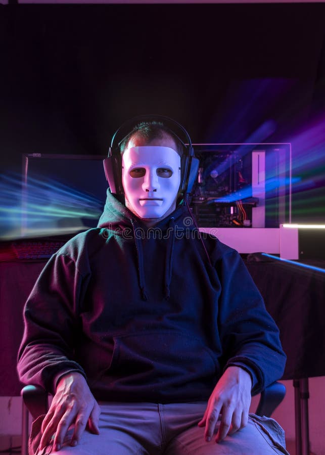 Portrait of the Young  Pro Gamer Playing in Online Video Game. Neon and magenta Colored Room. e-Sport Cyber Games Internet Championship. Motion sweep in image. Portrait of the Young  Pro Gamer Playing in Online Video Game. Neon and magenta Colored Room. e-Sport Cyber Games Internet Championship. Motion sweep in image