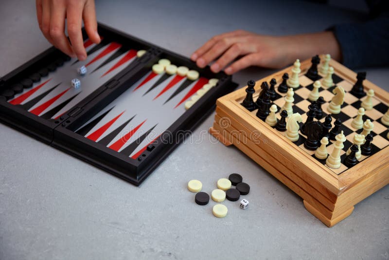 Board games on the table. Chess, backgammon, checkers. Boards are laid out for the game. Play, have fun at home. Leisure, hobbies