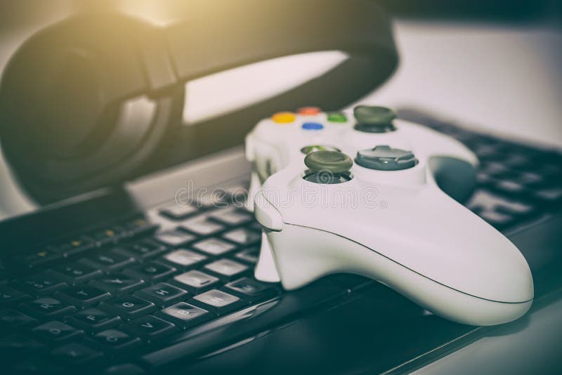 Free Photo  Gamer using controller to play online video games on computer.  man playing game with joystick and headphones in front of monitor. player  having gaming equipment, doing fun activity.