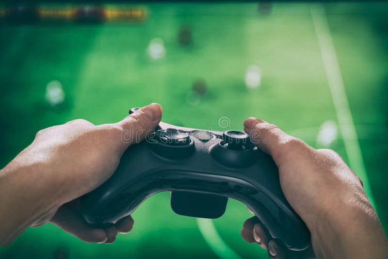 Free Photo  Gamer using controller to play online video games on computer.  man playing game with joystick and headphones in front of monitor. player  having gaming equipment, doing fun activity.