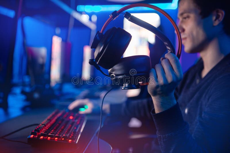 Free Photo  Player winning video games with controller and headset in  front of monitor. man using joystick and headphones, playing online games  on computer. person celebrating game win for leisure.