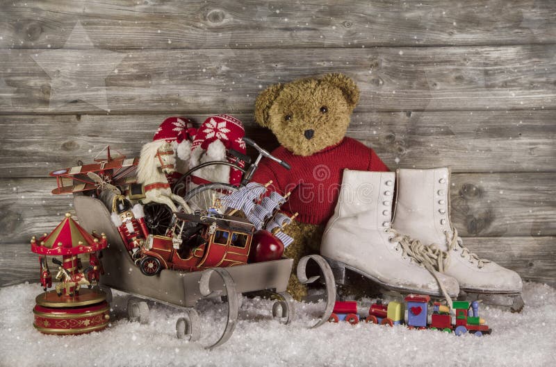 Old children toys on wooden background for christmas decoration in vintage style. Old children toys on wooden background for christmas decoration in vintage style.