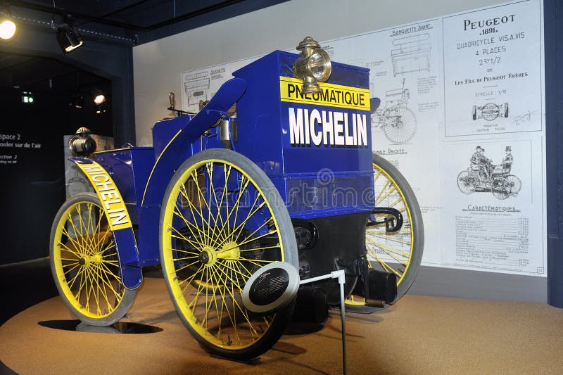 Old car equipped for the first time at the time of tires exposed to the Michelin museum in Clermont-Ferrand. Old car equipped for the first time at the time of tires exposed to the Michelin museum in Clermont-Ferrand