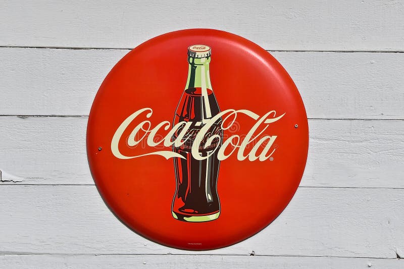 Gammal coca - colaflasktecken arkivfoto