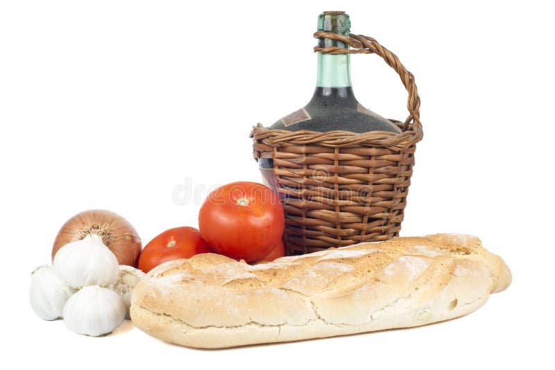 Gammal karaff av rött vin med den nya bröd, tomater, Garlics och löken. royaltyfria foton Gammal karaff av rött vin med den nya bröd, tomater, Garlics och löken. royaltyfria foton