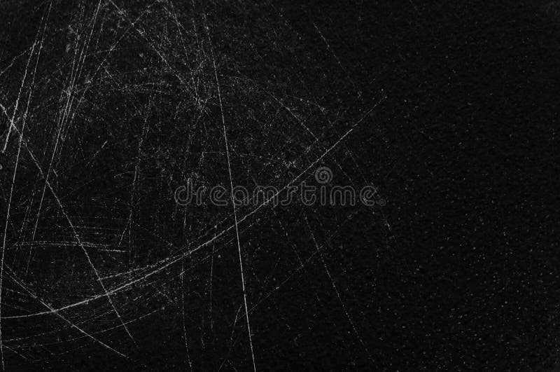 Old black stucco wall with white scratches and scuffs texture. textured grunge black board with chalk. Old black stucco wall with white scratches and scuffs texture. textured grunge black board with chalk