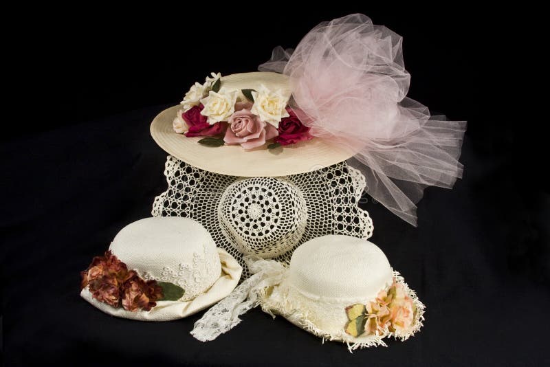 A collection of old fashioned hats with flowers,lace and netting. A collection of old fashioned hats with flowers,lace and netting