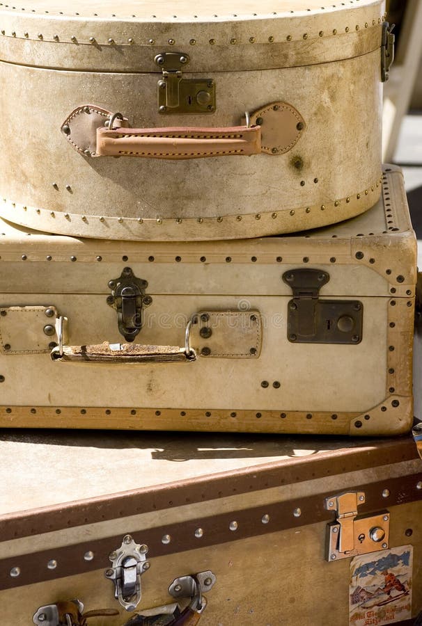 A pile of old suitcases well worn with hints of where they have been. A pile of old suitcases well worn with hints of where they have been.