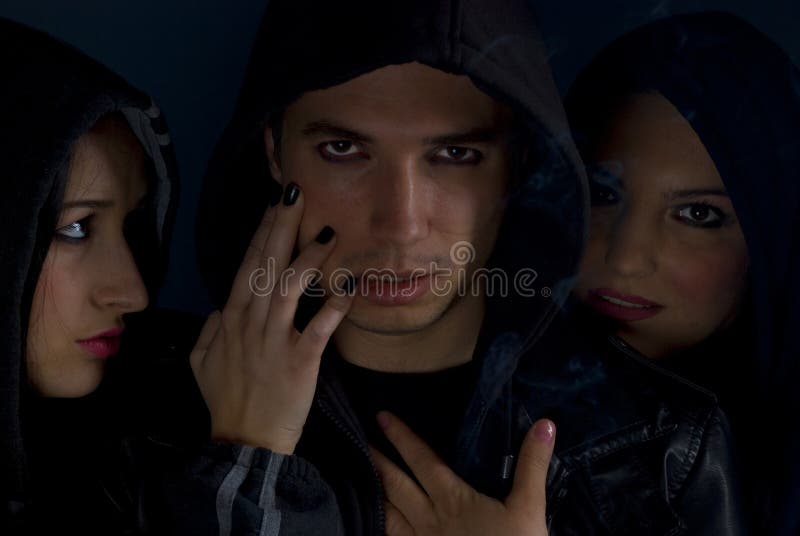 Gang members in the darkness stock image