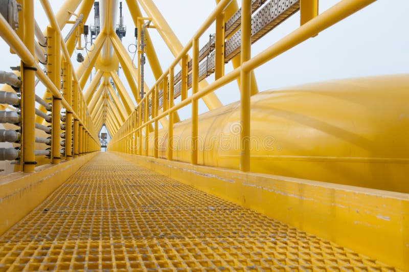 Gangway or walkway linked between production platform and living quarter.