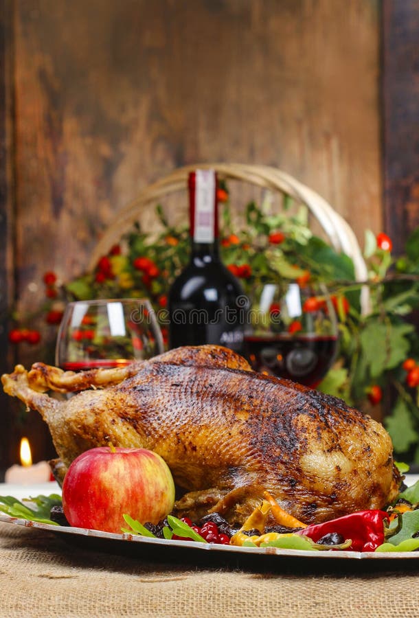 Roasted goose on wooden table. Popular christmas dish. Roasted goose on wooden table. Popular christmas dish