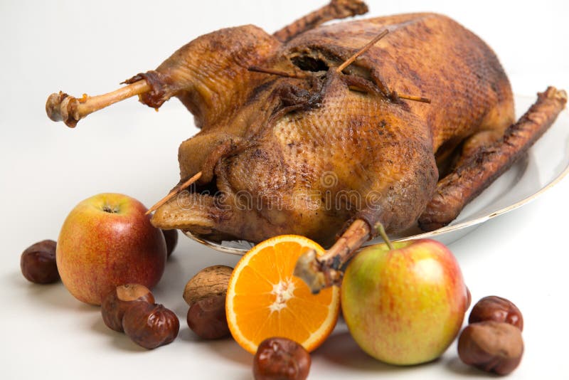 Roast goose with orange, apple, nuts and chestnuts. Roast goose with orange, apple, nuts and chestnuts