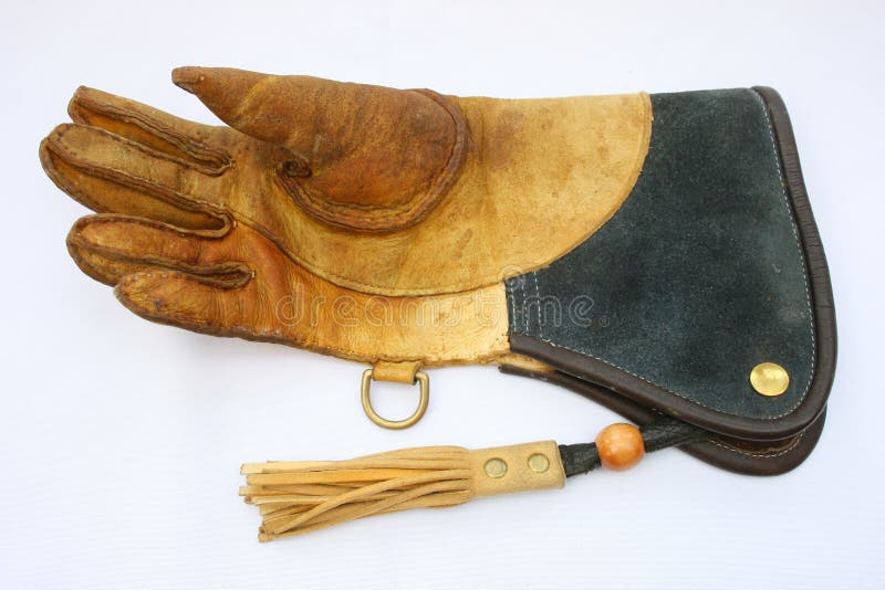 Right-hand falconry glove glove for left-handed falconer isolated on white background. Right-hand falconry glove glove for left-handed falconer isolated on white background.