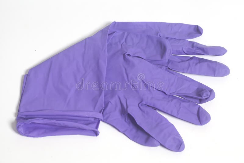 Gants pourpres de latex photos libres de droits Gants pourpres de latex photos libres de droits