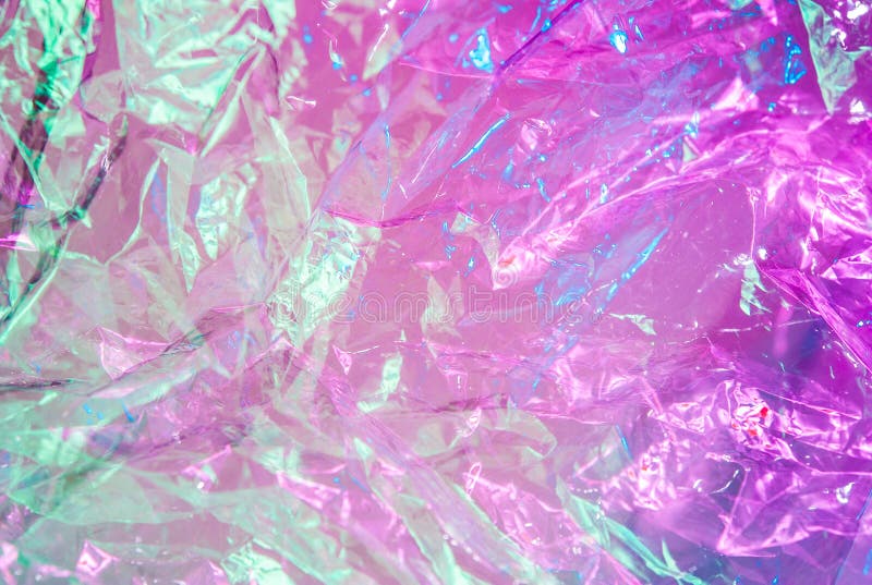 Abstract trendy holographic background in the style of the 80-90s. Real texture of crumpled cellophane film in bright acid colors. Synthwave Vaporwave webpunk Massureaism aesthetics. Abstract trendy holographic background in the style of the 80-90s. Real texture of crumpled cellophane film in bright acid colors. Synthwave Vaporwave webpunk Massureaism aesthetics.