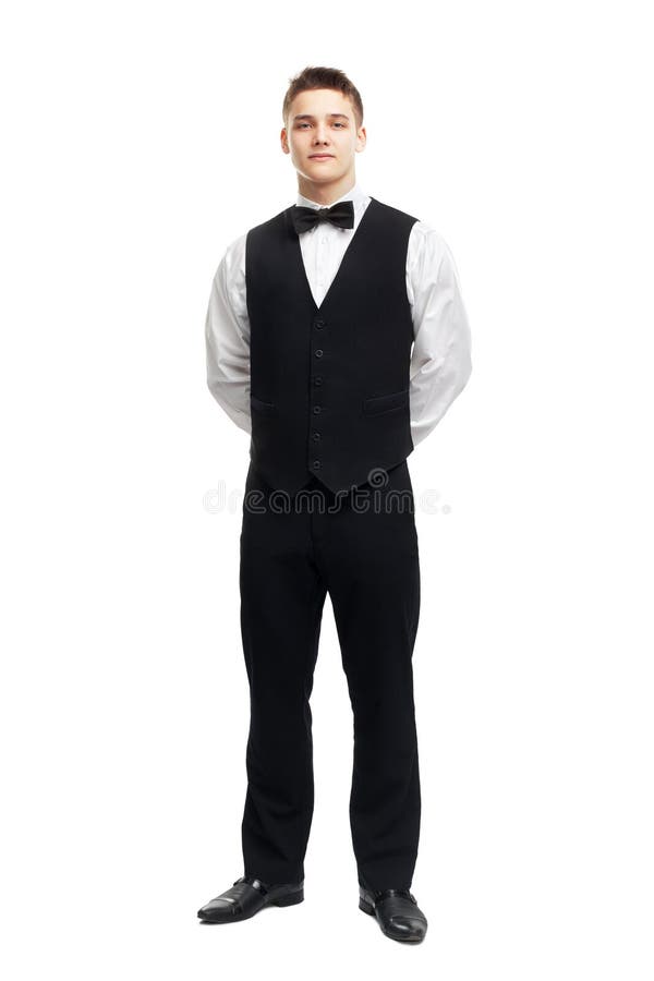 Ganzaufnahme des jungen lächelnden Kellners stockfotografie Ganzaufnahme des jungen lächelnden Kellners stockfotografie