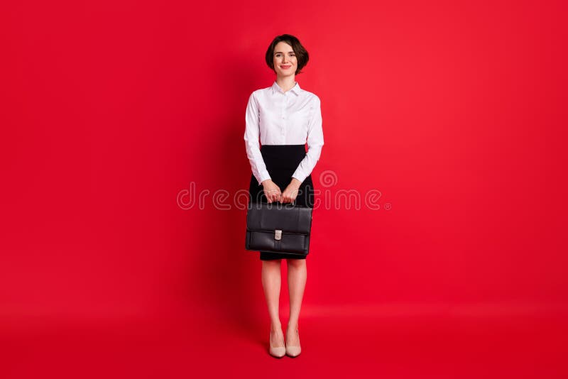 Full length body size photo business woman keeping leather diplomat smiling isolated bright red color background. Full length body size photo business woman keeping leather diplomat smiling isolated bright red color background.