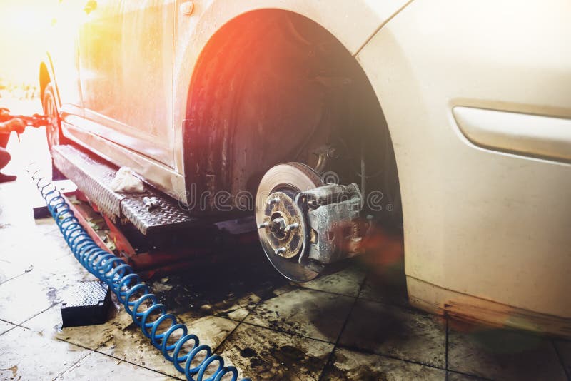 Garage and auto mechanic car service concept. Automobile repair technology and troubleshooting. Toned stock photo Garage and auto mechanic car service concept. Automobile repair technology and troubleshooting. Toned stock photo