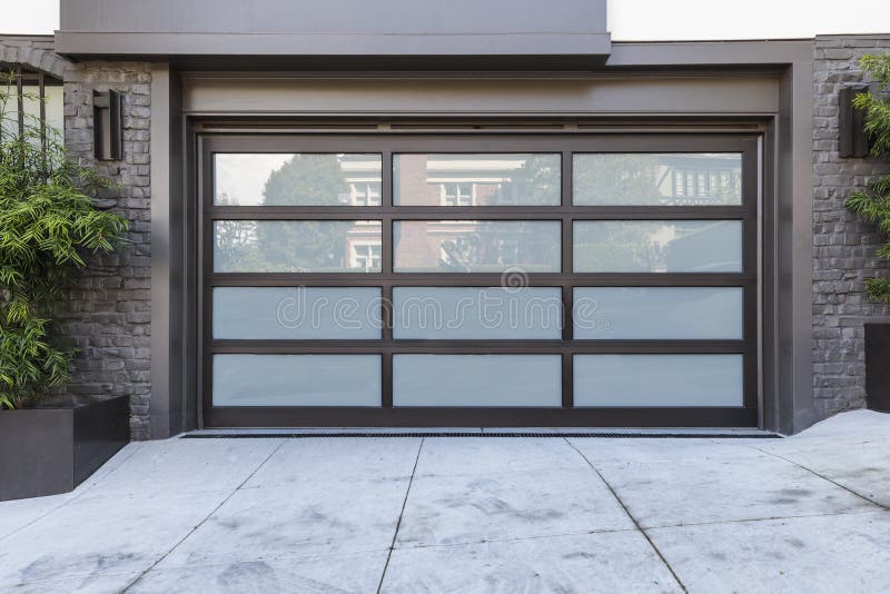 2 car garage door with frosted glass casting a reflection. 2 car garage door with frosted glass casting a reflection