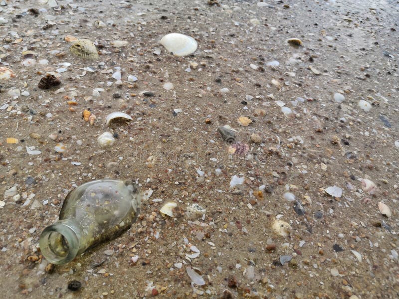 Garbage bottle onâ€‹ theâ€‹ beach royalty free stock photo