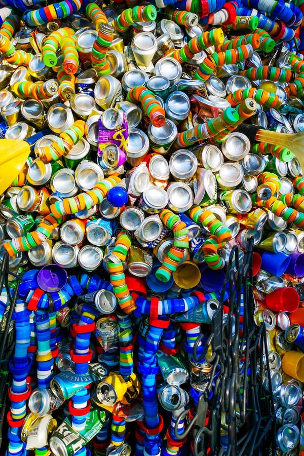 Garbage cans and plastic lids in multi-colored designs stock image