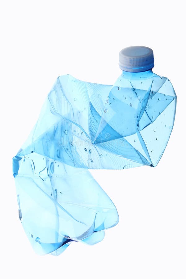 Garbage concept: empty crushed plastic bottle isolated on white background with clipping path and copy space for your text stock photography