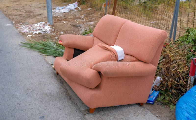 Old Furniture Sofa On Street Outside Garbage Day Stock Photo