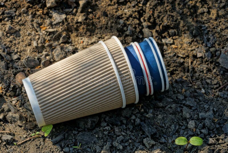 Garbage from empty paper cups lying on the ground royalty free stock photography