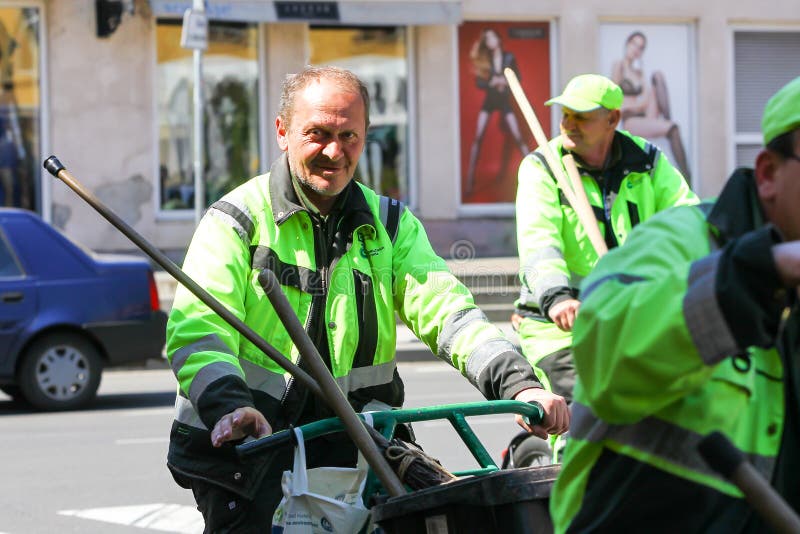 Garbage man driving bikes. Zagreb, Croatia - April 17, 2020 : A group of garbage man driving bikes with trash cans on it in downtown of Zagreb, Croatia royalty free stock photos Garbage man driving bikes. Zagreb, Croatia - April 17, 2020 : A group of garbage man driving bikes with trash cans on it in downtown of Zagreb, Croatia royalty free stock photos