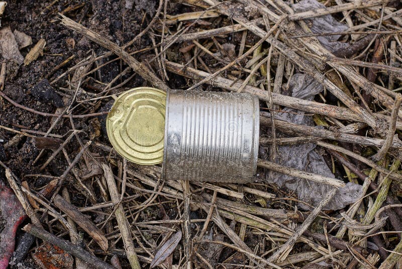 Garbage from one empty white dirty can stock images
