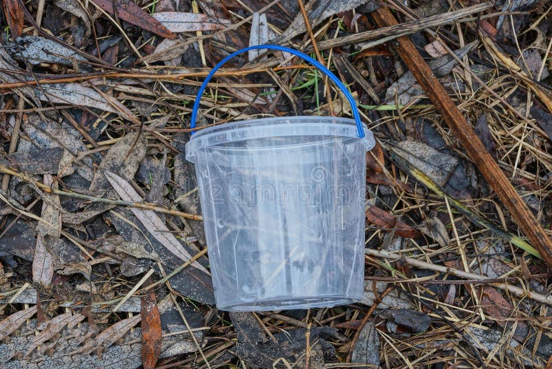Garbage from one white empty plastic bucket royalty free stock images