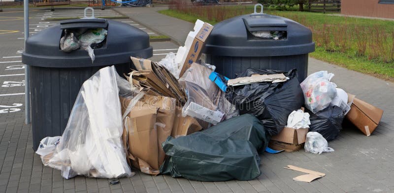 Garbage overflowing cardboard, plastic and household waste