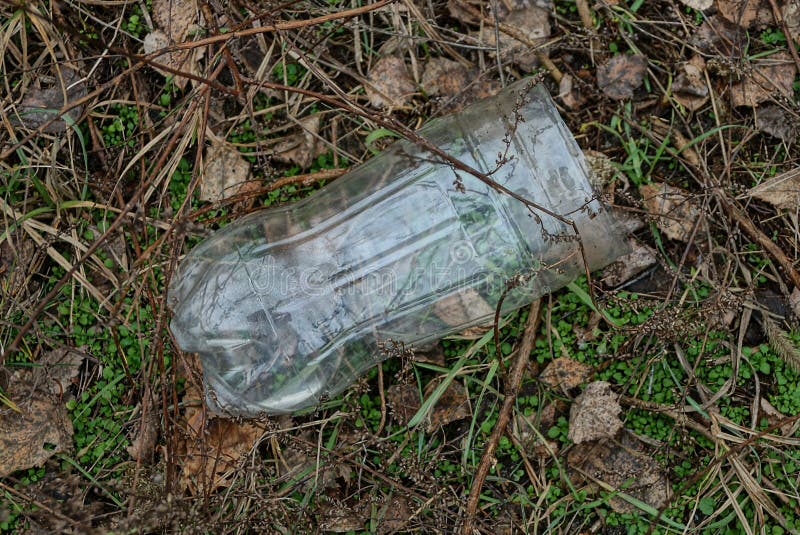 Garbage from an part on empty plastic bottle stock image