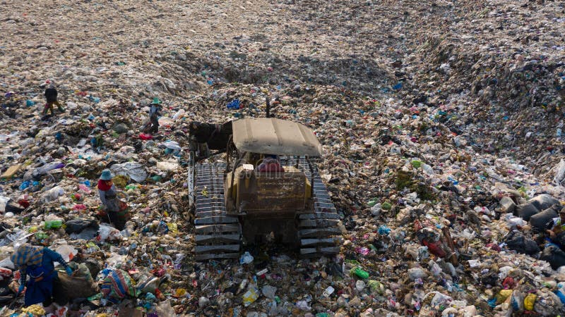Garbage pile in trash dump or landfill, Aerial view garbage trucks unload garbage to a landfill, global warming stock photo Garbage pile in trash dump or landfill, Aerial view garbage trucks unload garbage to a landfill, global warming stock photo