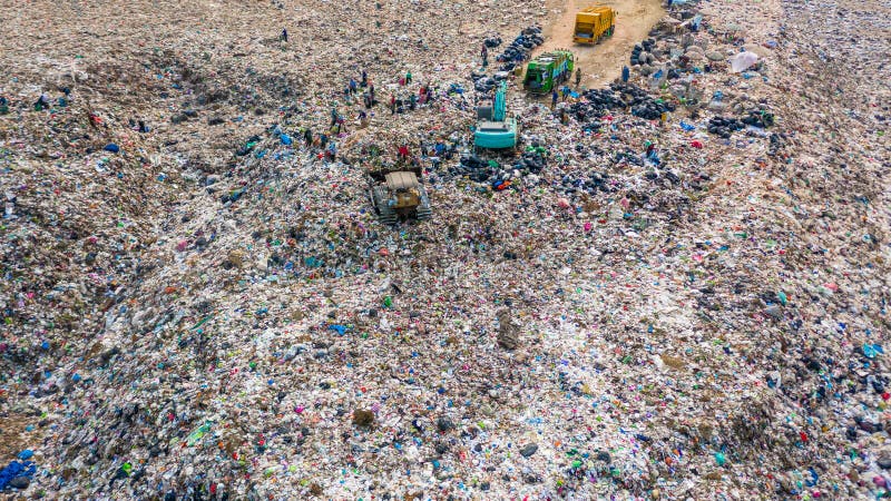 Garbage pile in trash dump or landfill, Aerial view garbage trucks unload garbage to a landfill, global warming stock images Garbage pile in trash dump or landfill, Aerial view garbage trucks unload garbage to a landfill, global warming stock images