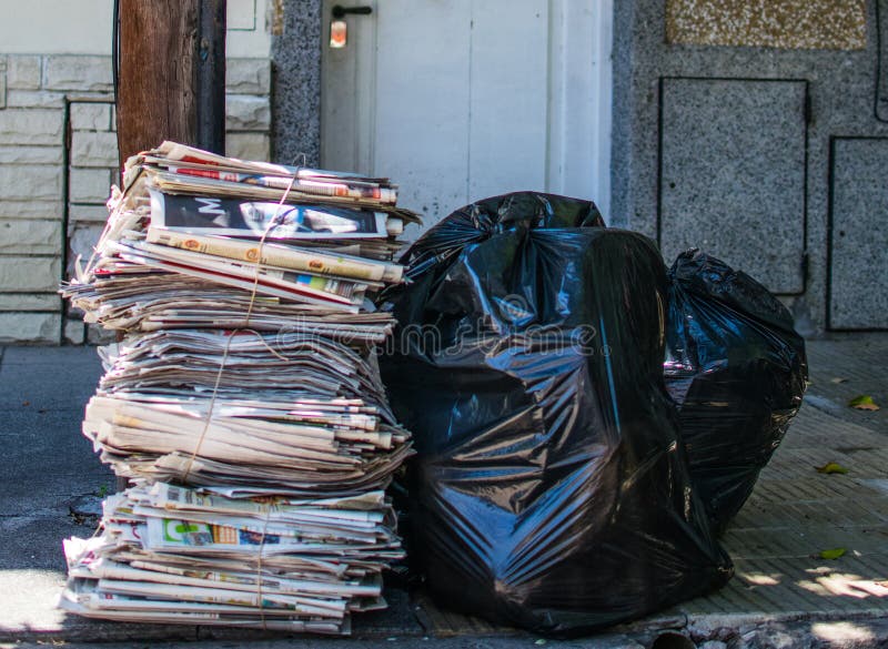 Garbage on the street stock photo. Image of newspaper 49721404
