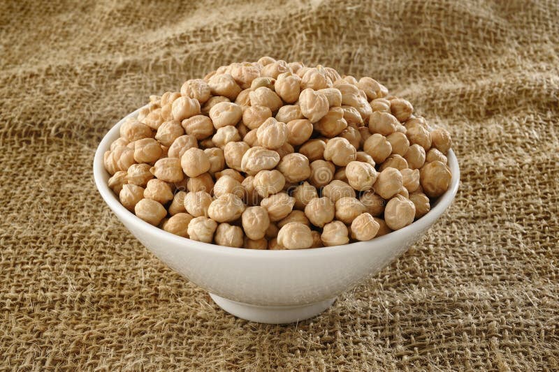 Garbanzo bean in bowl stock image. Image of white, uncooked 44583825