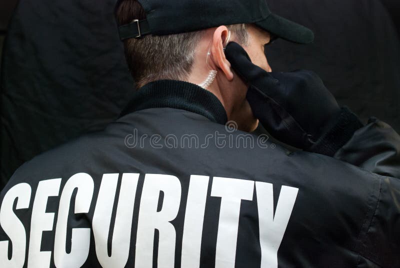Garde de sécurité Listens To Earpiece, dos de l'apparence de veste