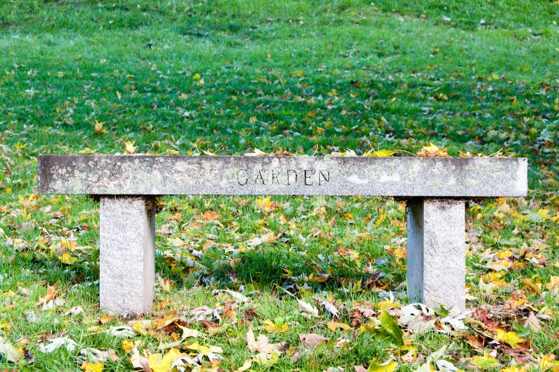 Garden bench in the grass stock photo. Image of signage 27443304